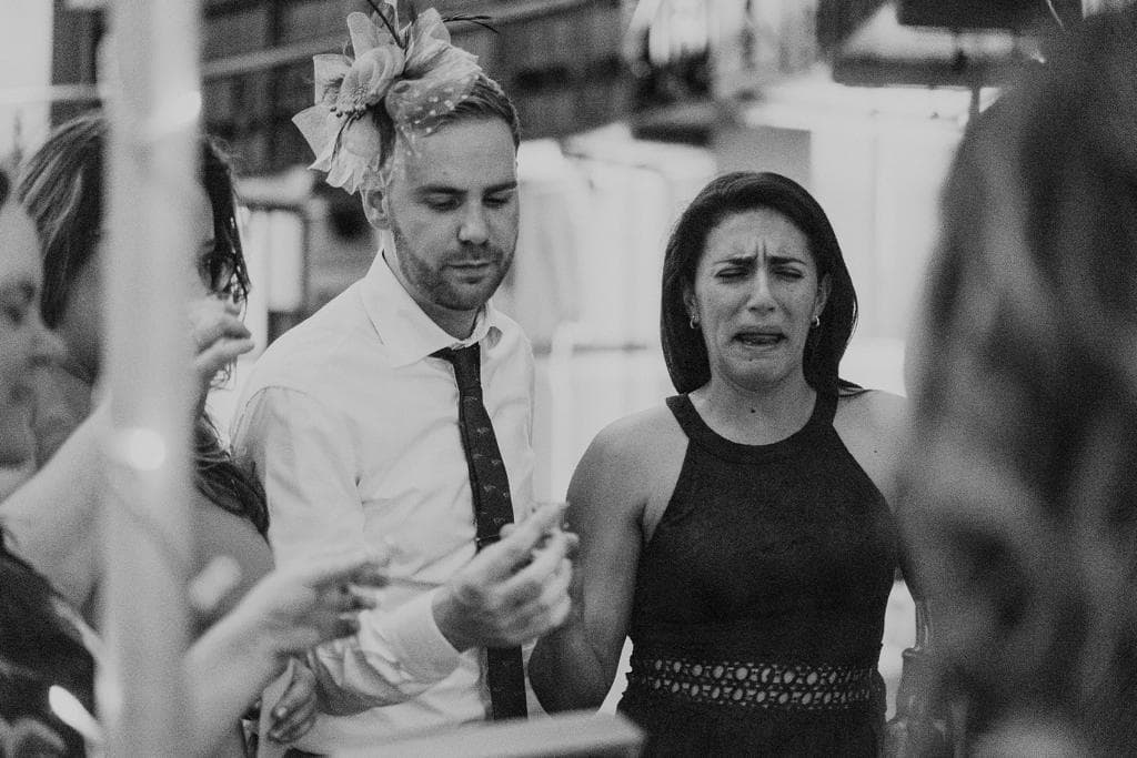 Ariana and Erik tasing whisky, Ariana is making a funny face