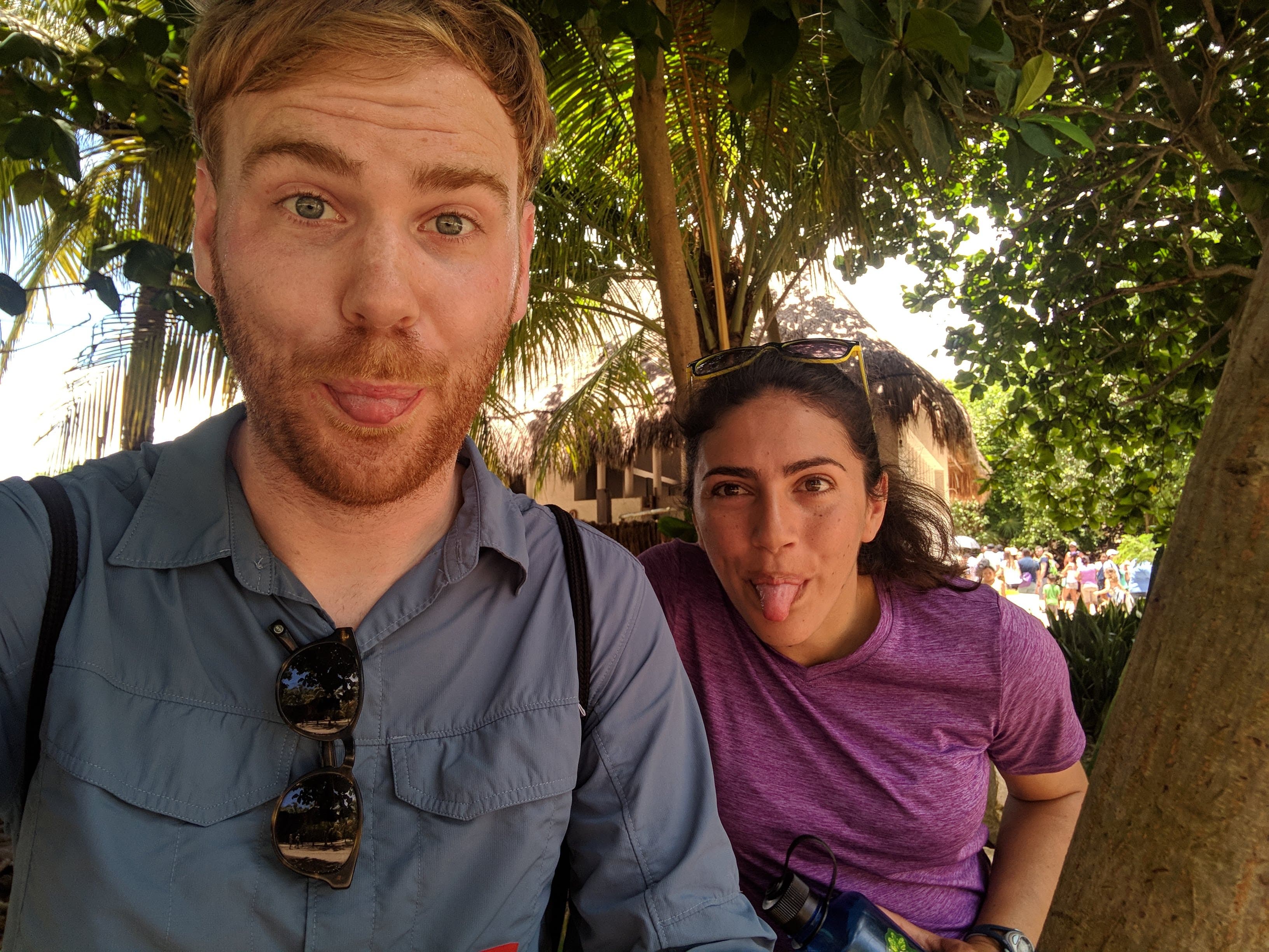 Ariana and Erik sticking their tongues out at the camera