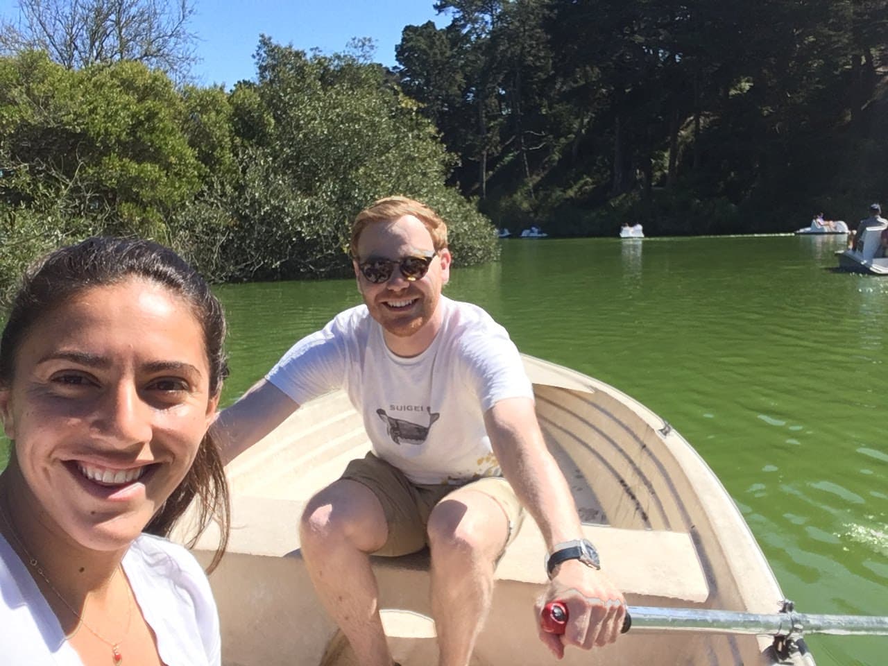 Ariana and Erik in a row boat on Stow Lake in San Francisco, California