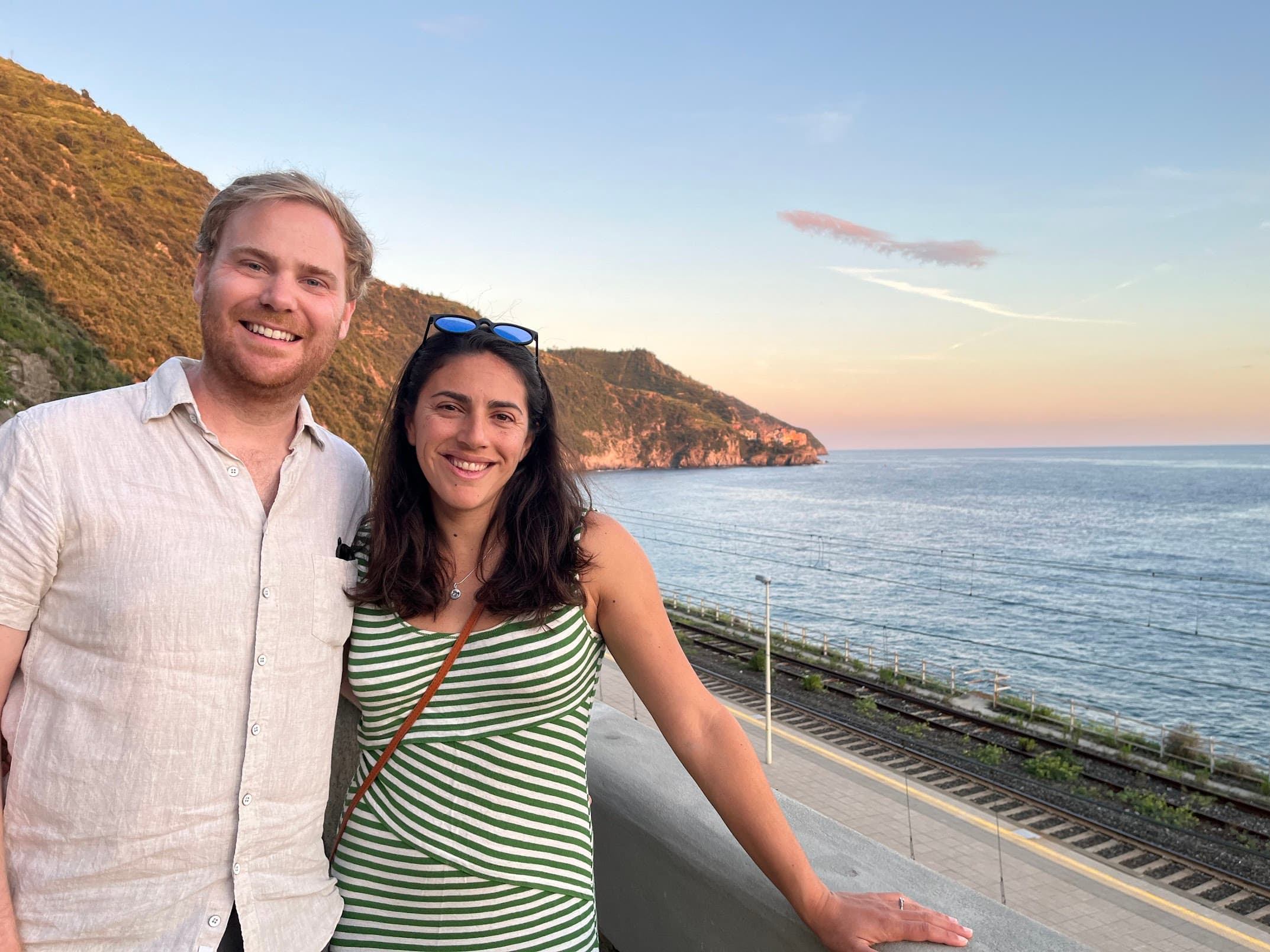 Erik and Ariana posing next to the sea in Cinque Terre, Italy