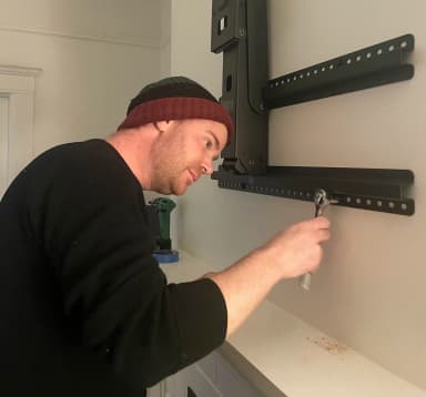 Erik installing the TV mount