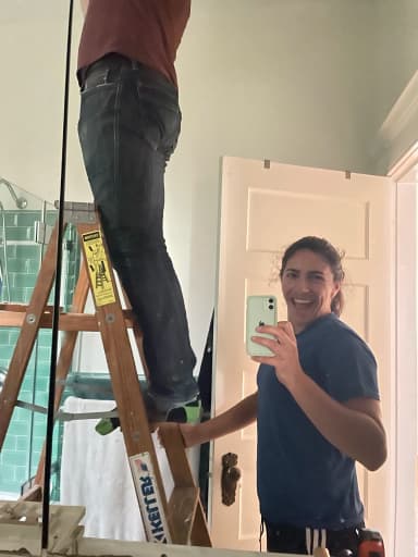 Ariana ensuring Erik is safe while inspecting bathroom fan